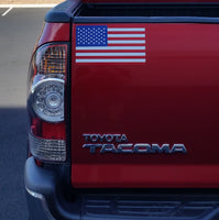 United States of America flag magnet on a toyota tacoma